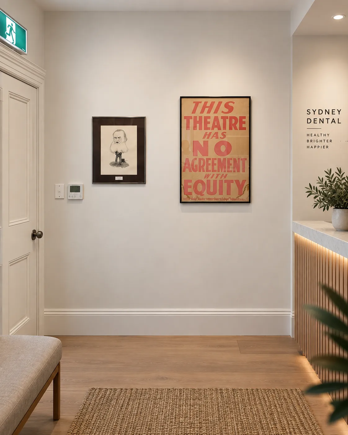 Framed artwork and theatre poster installed in a commercial hallway