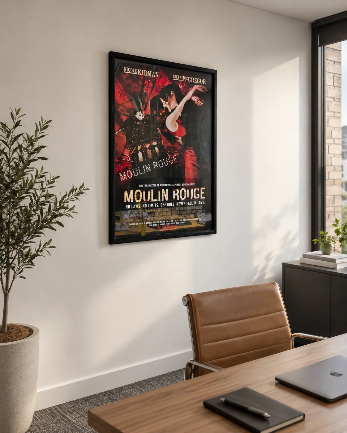 Framed film poster installed on a meeting room wall